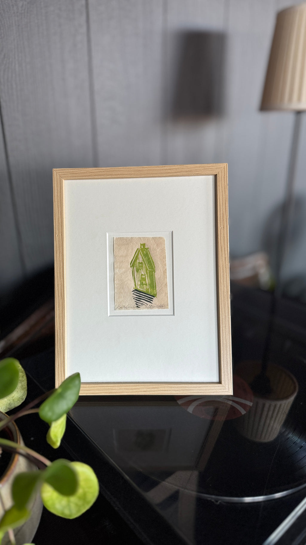 Shelter inkludert passepartout og ramme